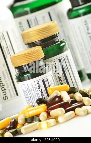 Composition with dietary supplement capsules and containers. Variety of drug pills Stock Photo