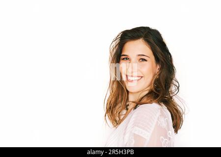 Close up portrait of happy laughing woman, posing on white background, messy hair Stock Photo