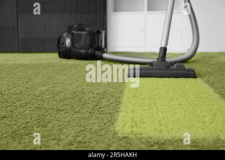 Vacuuming carpet. Clean area after using device in room Stock Photo
