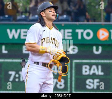 New York Mets shortstop Luis Guillorme, left, tags out Pittsburgh Pirates'  Connor Joe, right, on a steal-attempt at second base in the first inning in  a baseball game in Pittsburgh, Saturday, June