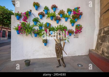 La Regadora  (Watering Can Lady) - Monument to yard caretakers at Plaza de la Puerta del Rincon by Jose Manuel Belmonte - Cordoba, Andalusia, Spain Stock Photo