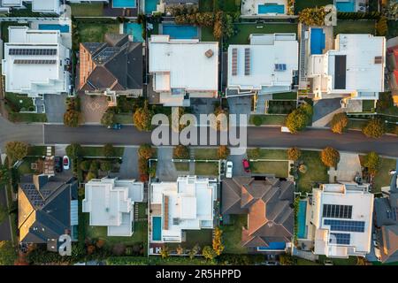 Late afternoon top down aerial view of modern upmarket houses in outer suburban Sydney, Australia Stock Photo