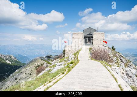 A winding path high on the mountain leads to the entrance of the Petar II Petrovic-Njegos Mausoleum seen in the Cetinje Municipality of Montenegro in Stock Photo