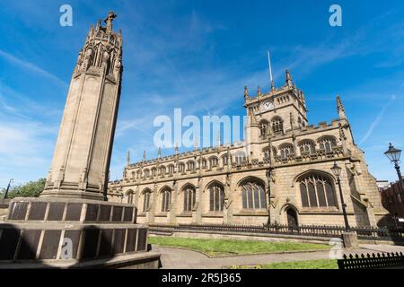The listed All Saints church and war memorial, Wigan, Greater Manchester, England, UK Stock Photo