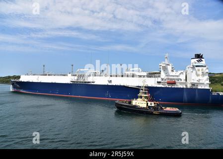 GASLOG HOUSTON a LNG tanker pictured in the Milford Haven Waterway, Pembrokeshire Dock, West Wales, also pictured  a tugboat alongside GASLOG HOUSTON Stock Photo