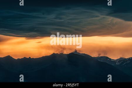 Dramatic landscape of colorful sunset sky and Asperitas cloud over Icelandic mountain in summer at Landmannalaugar, Iceland Stock Photo