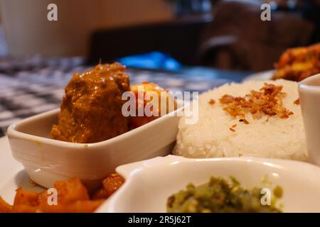 Rendang is a world-wide known delicious dish from Indonesia made from beef and spices with coconut milk Stock Photo