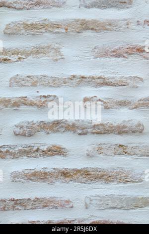 Background of Bricks Pattern on a White Wall Stock Photo