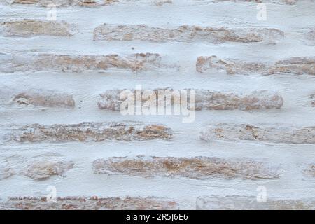 Background of Bricks Pattern on a White Wall Stock Photo