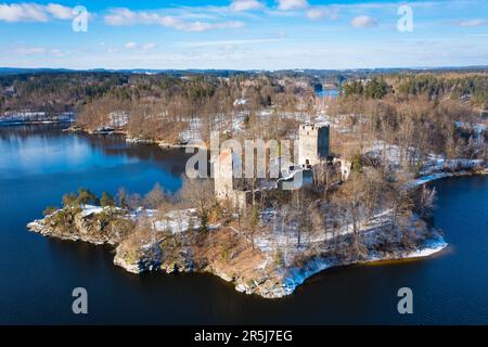 Snow covered Lichtenfels ruin in Waldviertel region. Beautiful famous landmark at lake Ottenstein, Lower Austria. Aerial view during winter. Stock Photo