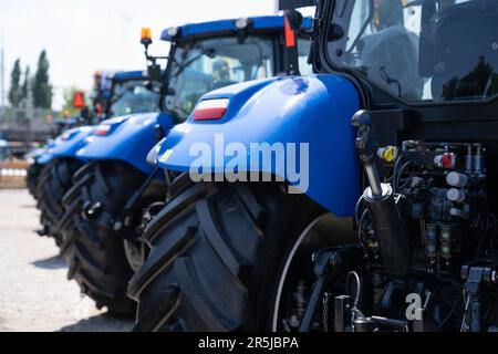 Agricultural tractors for sale in a row Stock Photo