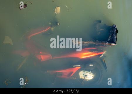 Abandoned scooter in St George Park lake Stock Photo