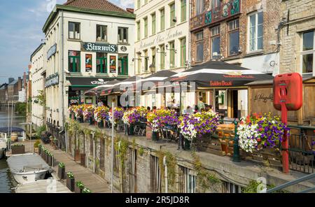 View of a nice corner with a terrace of a riverside bar in the Belgian city of Ghent. Place very frequented by tourists. Stock Photo