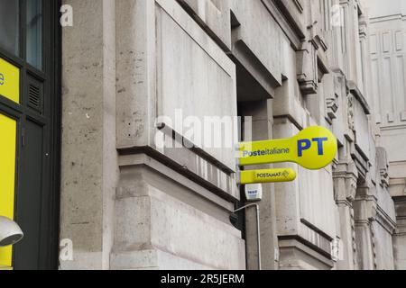 Poste Italiane is the national postal service provider in Italy with It's Bright Yellow Sign Logo and Blue Lettering Stock Photo