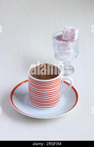 Turkish coffee and Turkish delight on a white background Stock Photo