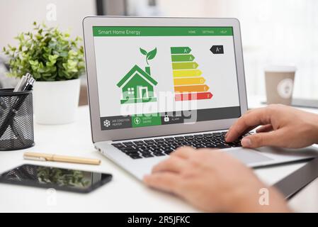 Energy efficiency app on screen. Ecology, eco house concept Stock Photo