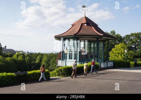 People relaxing next to the Bandstand, Horniman Gardens, Forest Hill, London, SE23, England, UK Stock Photo