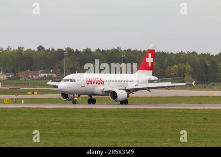 POLAND, GDANSK - 12 May, 2019: Aircraft line Swiss landing at the airport runway. The Lech Walesa Airport in Gdansk. Stock Photo