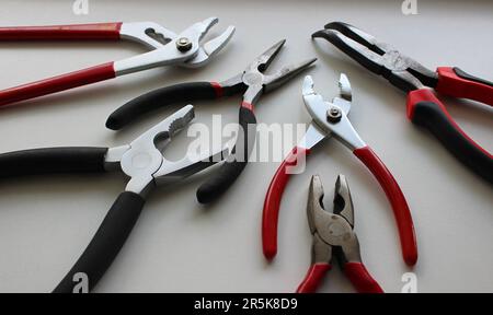 Set Of Different Types Of Mechanics Pliers On White Surface Detailed Stock Photo Stock Photo