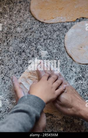 Father and son cooking together Stock Photo