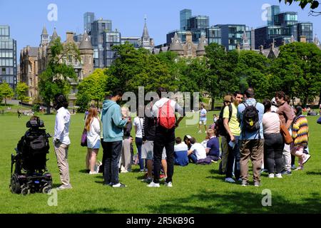 Edinburgh, Scotland, UK. 4th Jun 2023. Established in 1974 the Meadows Festival has been run on the first weekend of June almost every year since. Over the past 49 years the festival has changed and the event now boasts one of the UK’s largest community festivals with the biggest outdoor market in Edinburgh and something for all ages. The sunny weather brought out the crowds to enjoy the day.  People gathered with the Quartermile development looming large in the background. Credit: Craig Brown/Alamy Live News Stock Photo