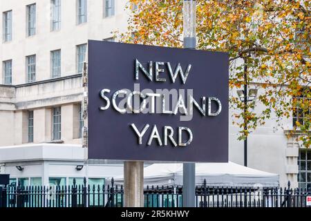 The iconic revolving sign outside New Scotland Yard on the Victoria Embankment, London, UK Stock Photo