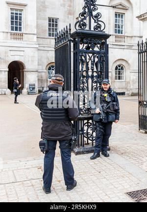 Armed police officers at the gates of Horseguards Parade, Whitehall, London, UK Stock Photo