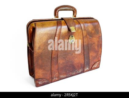 An old battered brown leather briefcase with a broken fastener, isolated on a white background Stock Photo