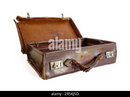 An old battered brown leather suitcase, isolated on a white background Stock Photo