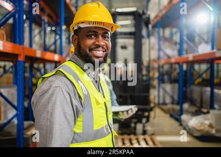 Warehouse workers checking and controlling boxes in warehouse Stock Photo