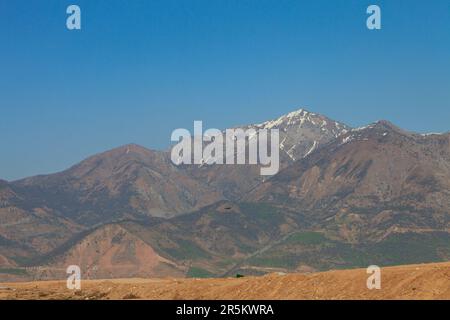 Chimgan mountains with little show on top and blue sky at sunny day Stock Photo