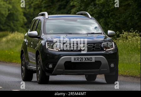 Stony Stratford,UK - June 2nd 2023:  2021 DACIA DUSTER travelling on an English country road Stock Photo