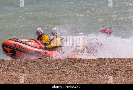 Joint emergency services display with focus on water safety. RNLI and Coastguard crews and vessels demonstrate the recovery of a victim from the sea. Stock Photo