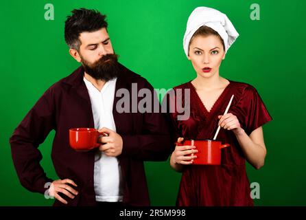 Young couple in love spending weekend together. Romantic couple having breakfast at home. Love, lifestyle and relationship concept. Husband and wife Stock Photo