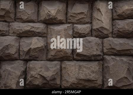 A brown stone wall photo, background, texture Stock Photo