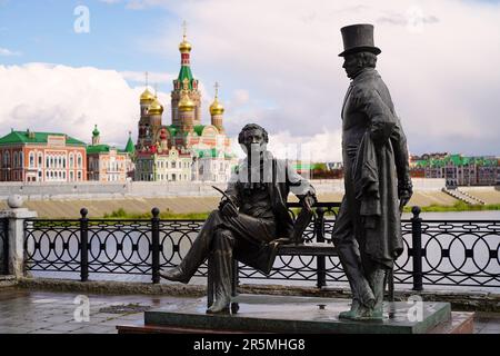 Yoshkar-Ola, Russia - September 6, 2021. Monument to A.S. Pushkin with his literary hero Eugene Onegin. Resurrection embankment. Opened in 2011. Stock Photo