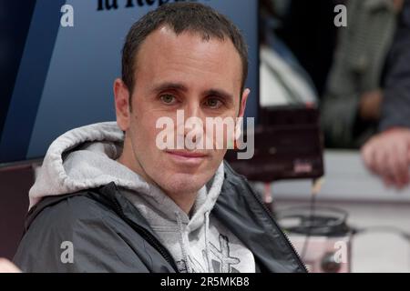 Italian cartoonist Michele Rech, also known as Zerocalcare, signs a copy of  a book by him to a fan Stock Photo - Alamy