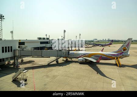 Bangkok Thailand - May 19, 2023 ; Nok Air's airplane, a popular low-cost airline in Thailand, is parked at Don Mueang International Airport, ready to Stock Photo