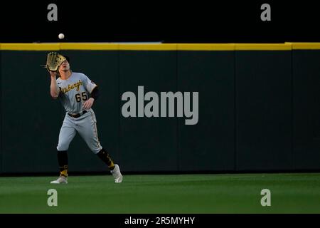 Pittsburgh Pirates center fielder Jack Suwinski looks out of the dugout  before the start of a baseball game against the Miami Marlins, Friday, June  23, 2023, in Miami. (AP Photo/Wilfredo Lee Stock