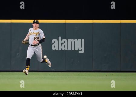 Pittsburgh Pirates center fielder Jack Suwinski reaches for a ball