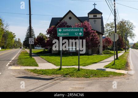 Traffic signs in front of the United Methodist Church on Race Street in Sugar Grove, Pennsylvania, USA Stock Photo