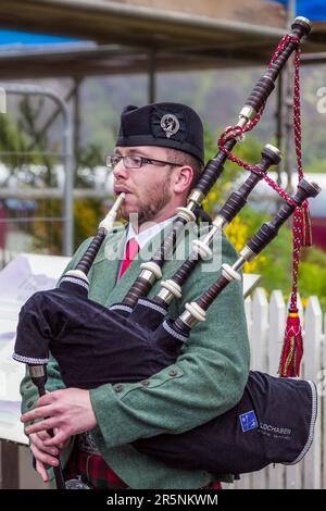 GLENFINNAN, LOCHABER/SCOTLAND - MAY 19 : Piper from the Lochaber Pipe Band at Glenfinnan in the Highlands of Scotland on May 19, 2011. Unidentified Stock Photo