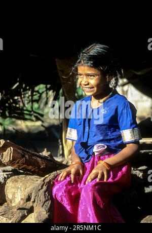 Betta kurumba tribal girl child sitting the tribal settlement at Theppakadu in Mudumalai National Park, Nilgiris, Tamil Nadu, South India, India Stock Photo