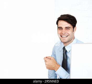 The smiling male office worker against white office Stock Photo - Alamy