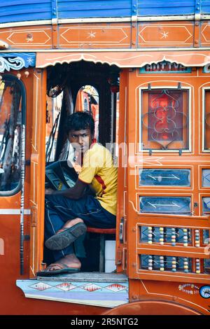 Young Teen Rides the Train in Mumbai, India Stock Photo