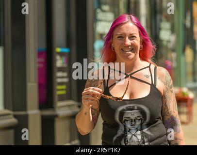 Red-haired tattooed woman in lingerie at home near the window stock photo