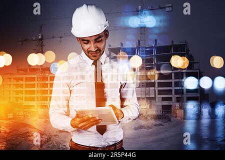 Building the cities of the future. a building contractor using his tablet superimposed over a build site. Stock Photo