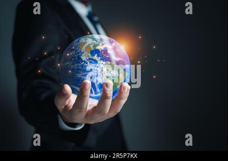 Businessman holding a model globe. concept of network communication. information network concept. Stock Photo