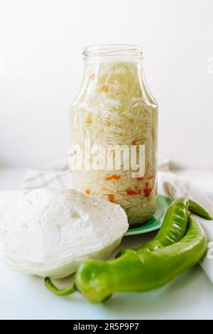 Fermented cabbage with carrots storage in glass jar Stock Photo