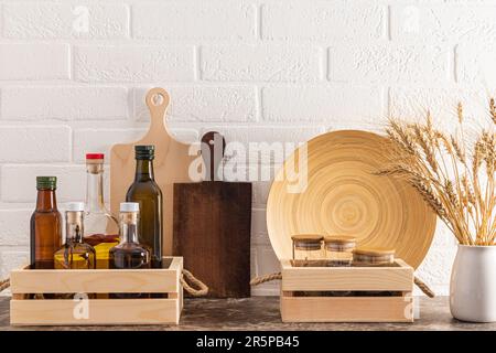 A modern food storage area in the kitchen made of environmentally friendly materials. Front view of the kitchen countertop. Eco style of the house Stock Photo